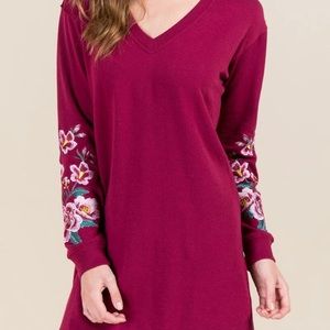 Sweater dress with embroidered sleeves.